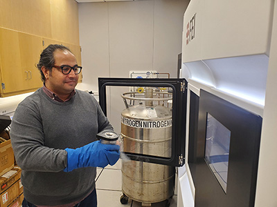 Staff Scientist Emre Firlar loads cryopreserved specimens into the electron microscope at the Rutgers Cryo-EM & Nanoimaging Facility.