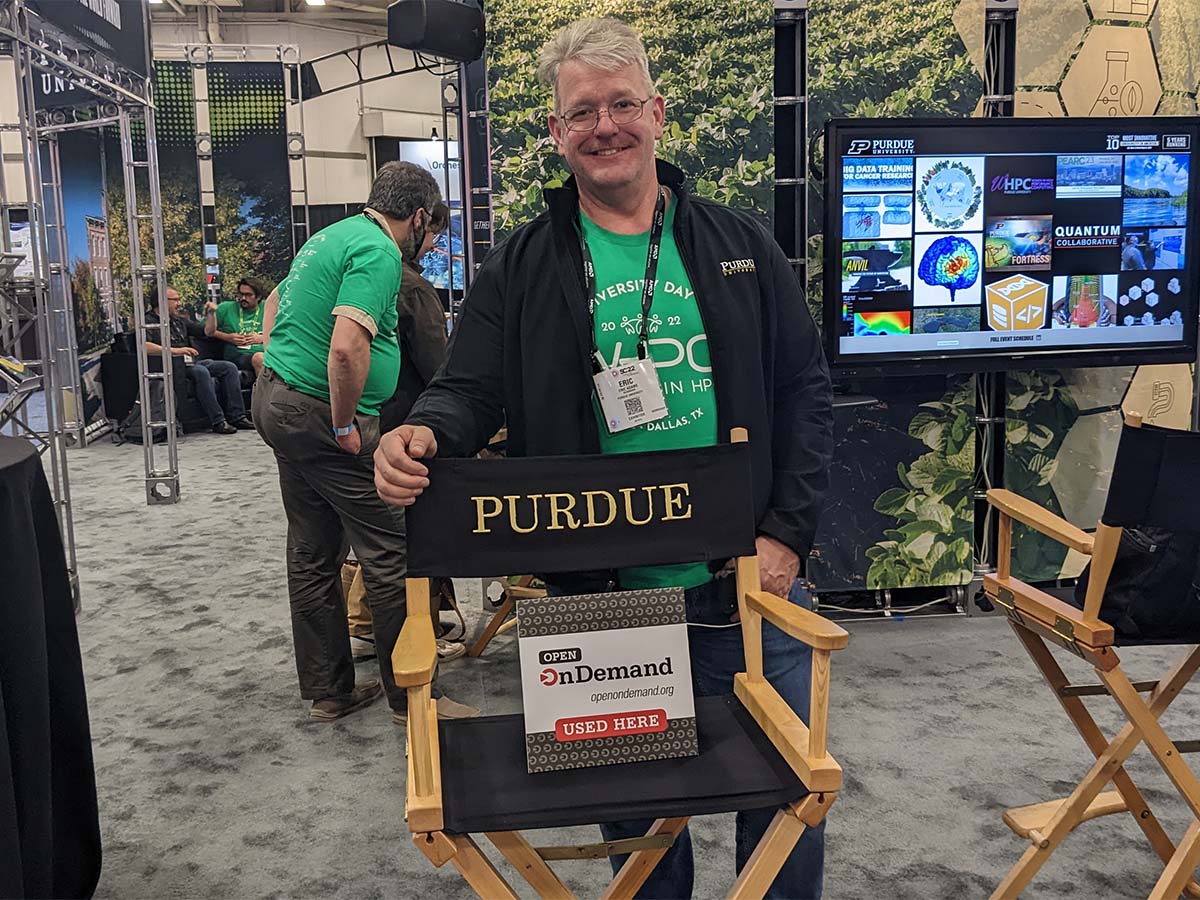 Purdue University booth at SC22 with Open OnDemand placard