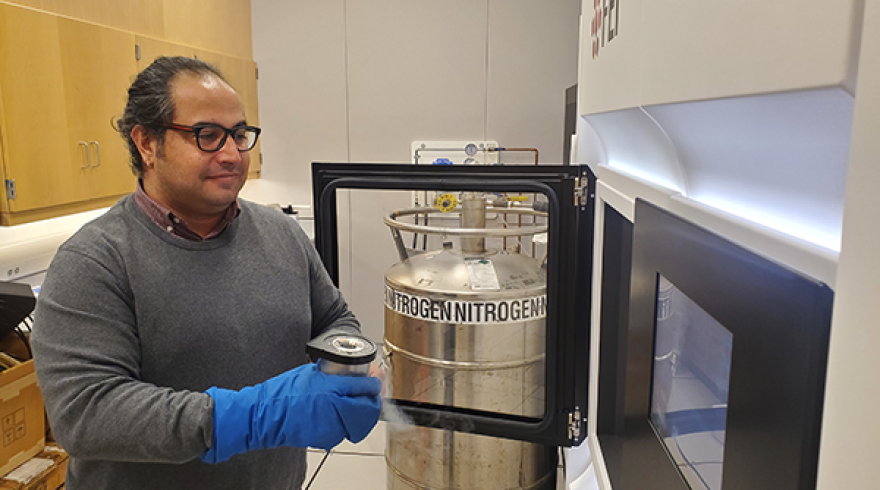 Dr. Emre Firlar loading cryopreserved specimens into the electron microscope